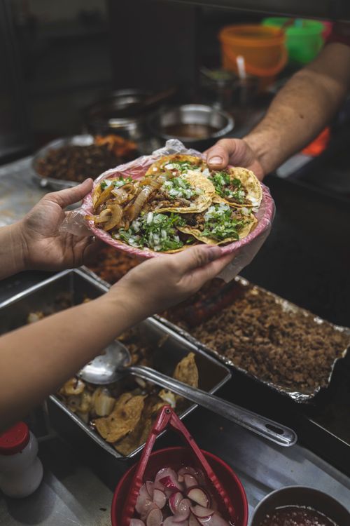 A colourful spread of tacos, fresh lime and Latin-inspired sides